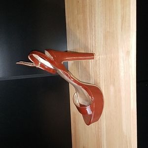 Brown patent leather stilettos.